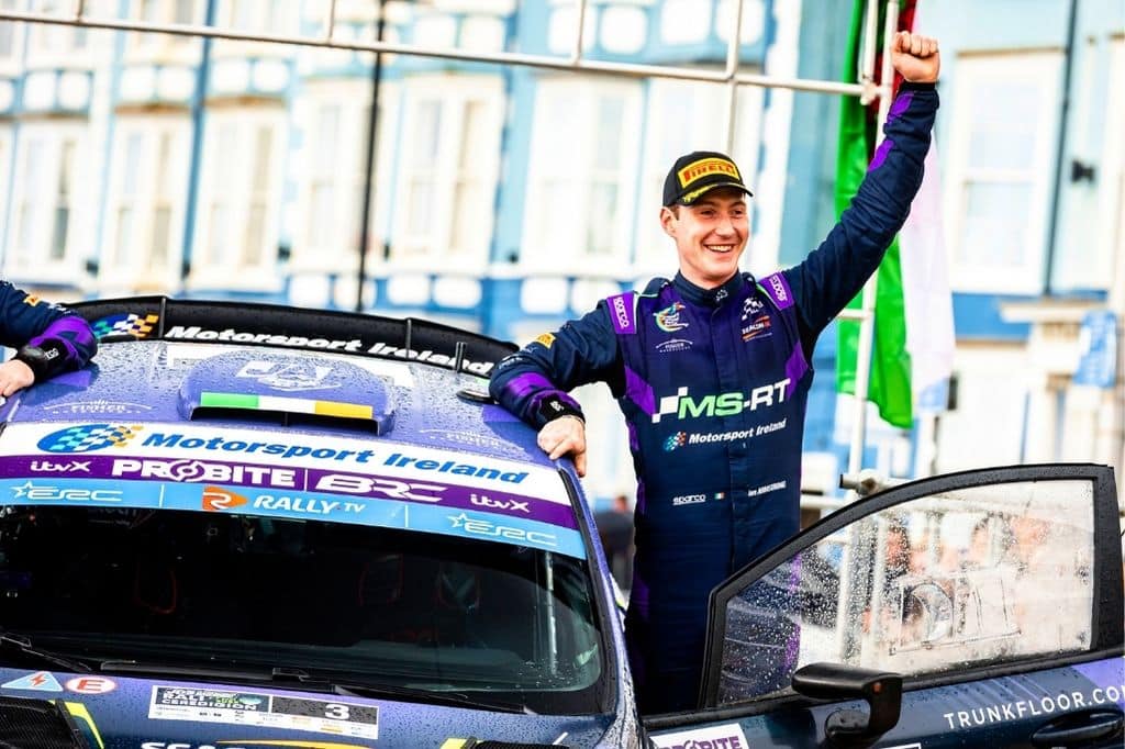 jon at the winning line arm in air