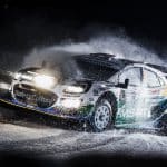 Jon Armstrong M-Sport Ford Rally Puma driving through snow during a night stage