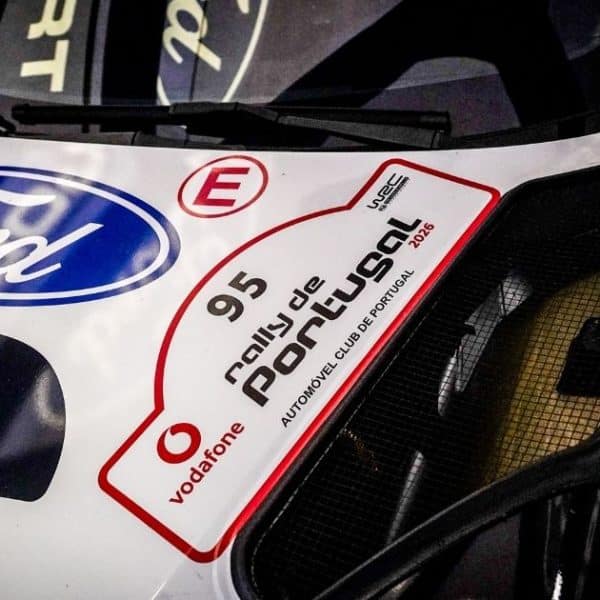 Press 3 Ford car with rally event sticker no 95 for Jon Armstrong
