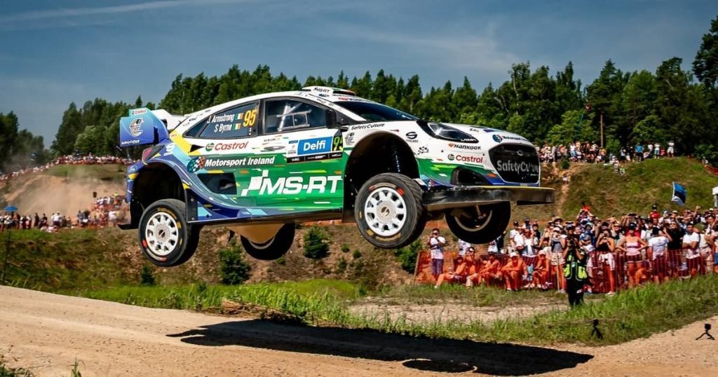 Jon Armstrong and Shane Byrne launch their M-Sport Ford Puma Rally1 over a jump in front of the crowds at Rally Estonia 2026