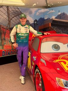 Jon Armstrong poses beside the Lightning McQueen car from the Disney Pixar Cars display at the Goodwood Festival of Speed 2026