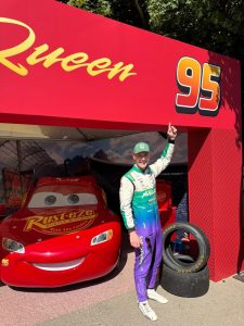 Jon Armstrong celebrates beside the Lightning McQueen number 95 car from Disney Pixar Cars at the Goodwood Festival of Speed 2026