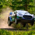 Jon Armstrong and Shane Byrne launch their M-Sport Ford Puma Rally1 over a jump on a fast forest gravel stage at Rally Finland 2026