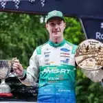 Jon Armstrong lifts the winner's cup and 1st Overall Driver trophy after victory at the Grampian Forest Rally 2026